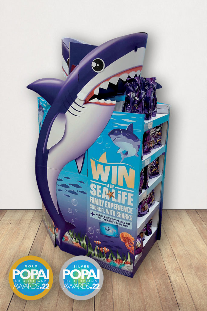Creative display unit for Cadbury, depicting a a 3 dimensional cartoon shark. The offer is a chance to win tickets for a Seas Life experience