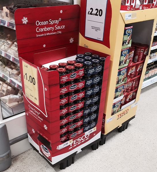 Quarter pallet display for ocean spray cranberry sauce in a Tesco store
